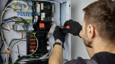 Electrician working on a residential electrical panel.